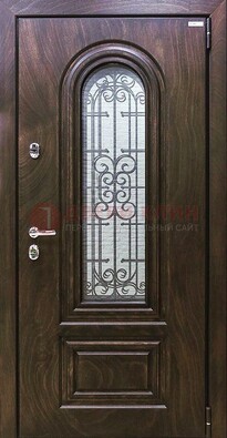 Темная филенчатая железная дверь со стеклом и ковкой ДСК-102 в Волхове