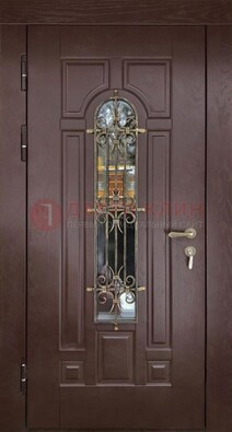 Темная железная дверь со стеклом и ковкой для частного дома ДСК-156 в Голицино
