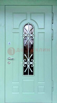 Светло-зеленая железная дверь со стеклом и ковкой ДСК-195 в Голицино