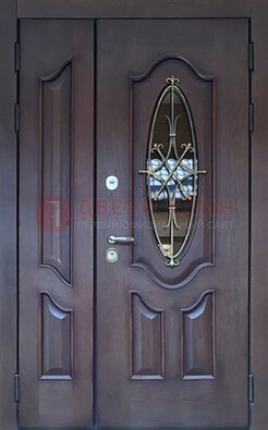 Темная металлическая дверь Винорит со стеклом и ковкой ДСК-239 в Голицино